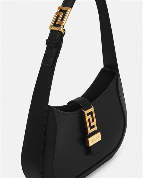 models carrying the versace greca goddess small small shoulder bag|Versace Small Greca Goddess Shoulder Bag.